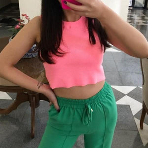 Shop for cropped tank tops Online in the USA at ShopUfreakb.com | Fast and Free Shipping | A Crop Tank Top Neon Pink featuring a round neckline and cropped hem. | Women Tank Tops | Different Colors